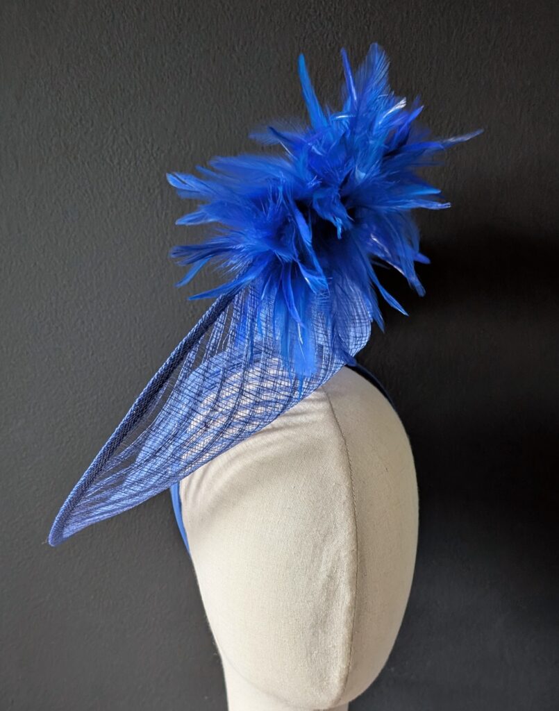 Royal percher hat with spiked feather trim. $60