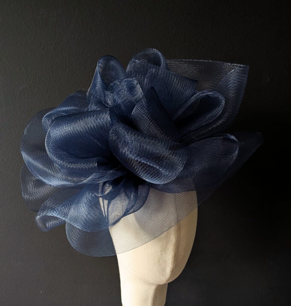 Large crin fascinator on double band. $75