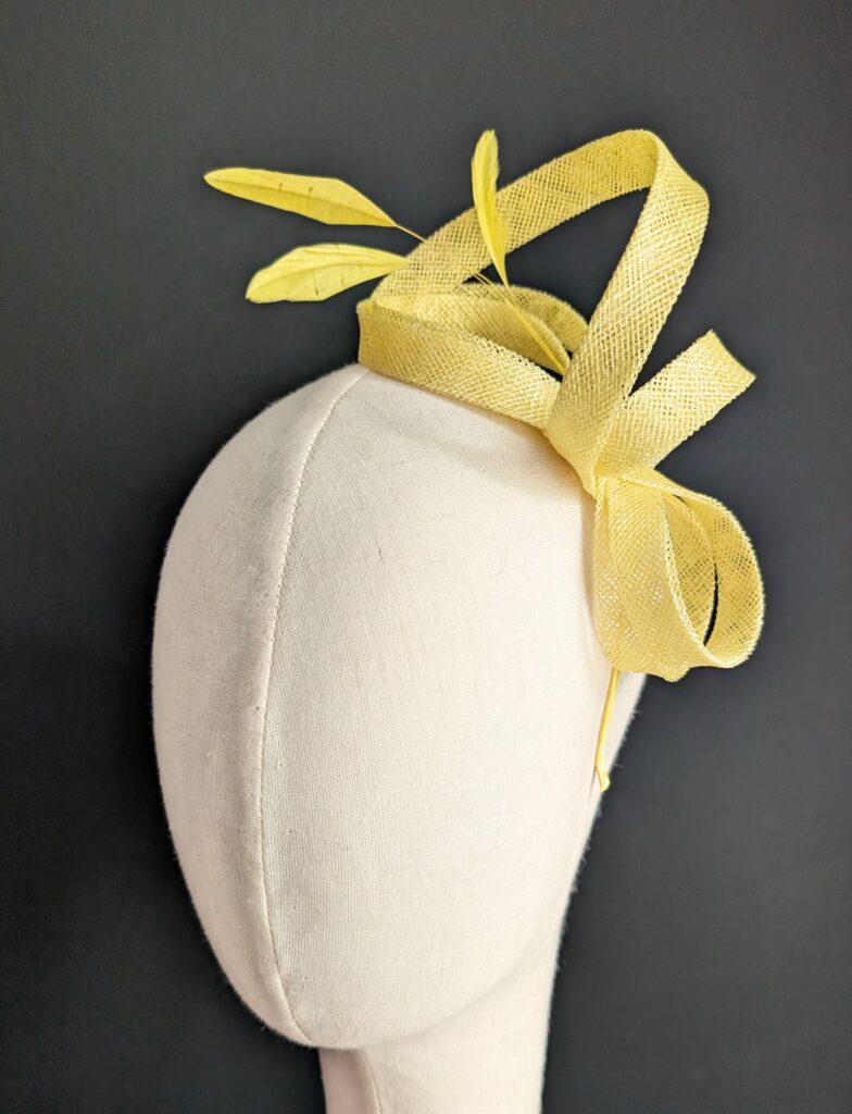 Yellow sinamay fascinator on thin band. $40